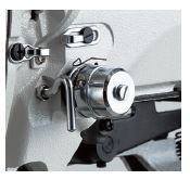 The machine is provided as standard with the active tension (electronic thread tension control mechanism)